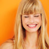 Young blond woman laughing